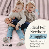 siblings holding baby brother in navy blue newborn knotted gown with newborn baby hat soft newborn baby gown, newborn take home outfit