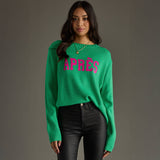 Woman wearing a green sweater with 'APRèS' text on a gray background